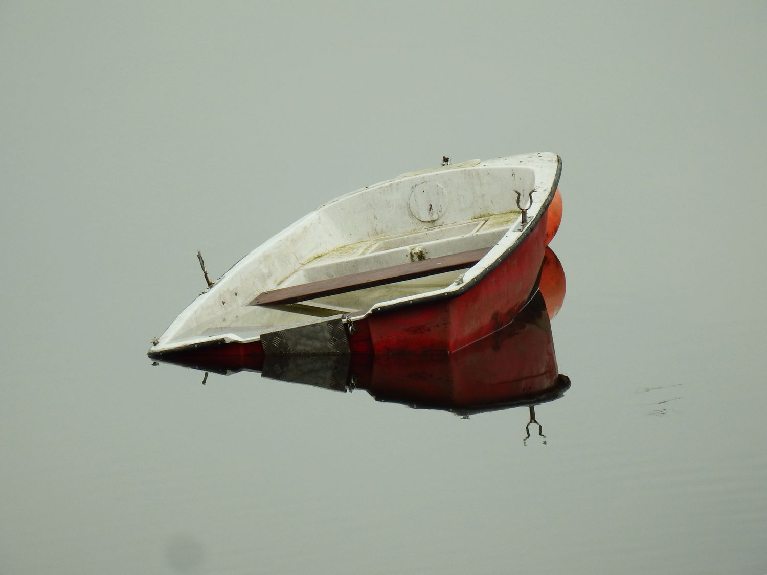 A red sunken boat. 