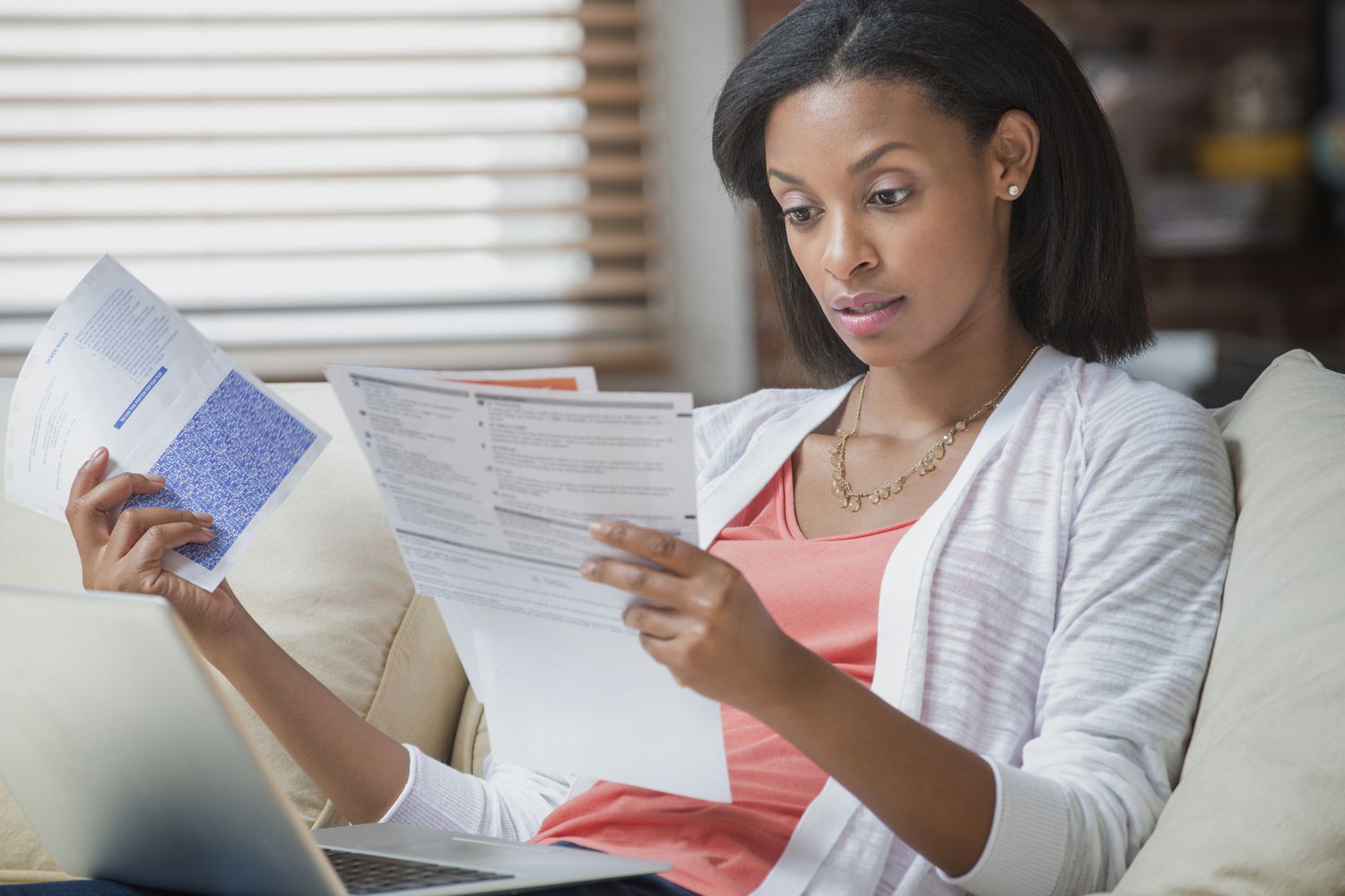 Woman reviewing her private mortgage insurance costs on statement