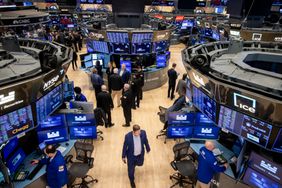Traders work on the floor of the New York Stock Exchange