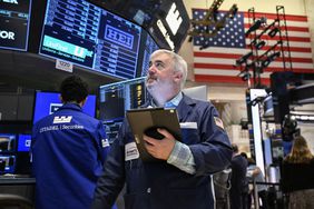 Traders work on the floor of the New York Stock Exchange