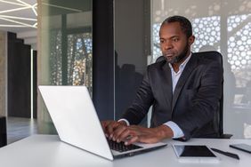 Investment banker analyzing financial data