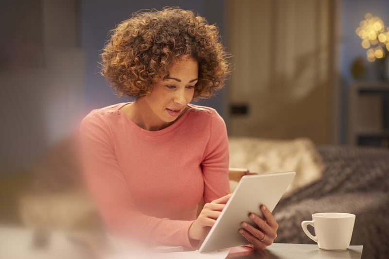 Woman researching which student loan she should pay off first