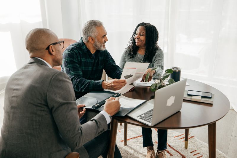 Mortgage broker meeting with couple