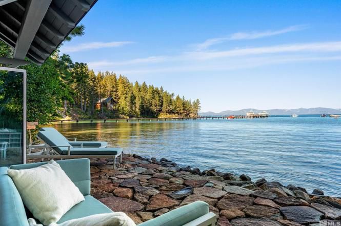 Lake Tahoe splashes against the waterfront of this Nevada home. 