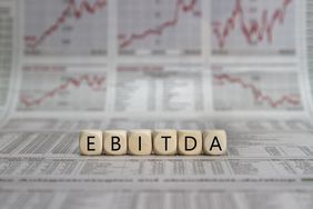 Blocks reading "EBITDA" over charts