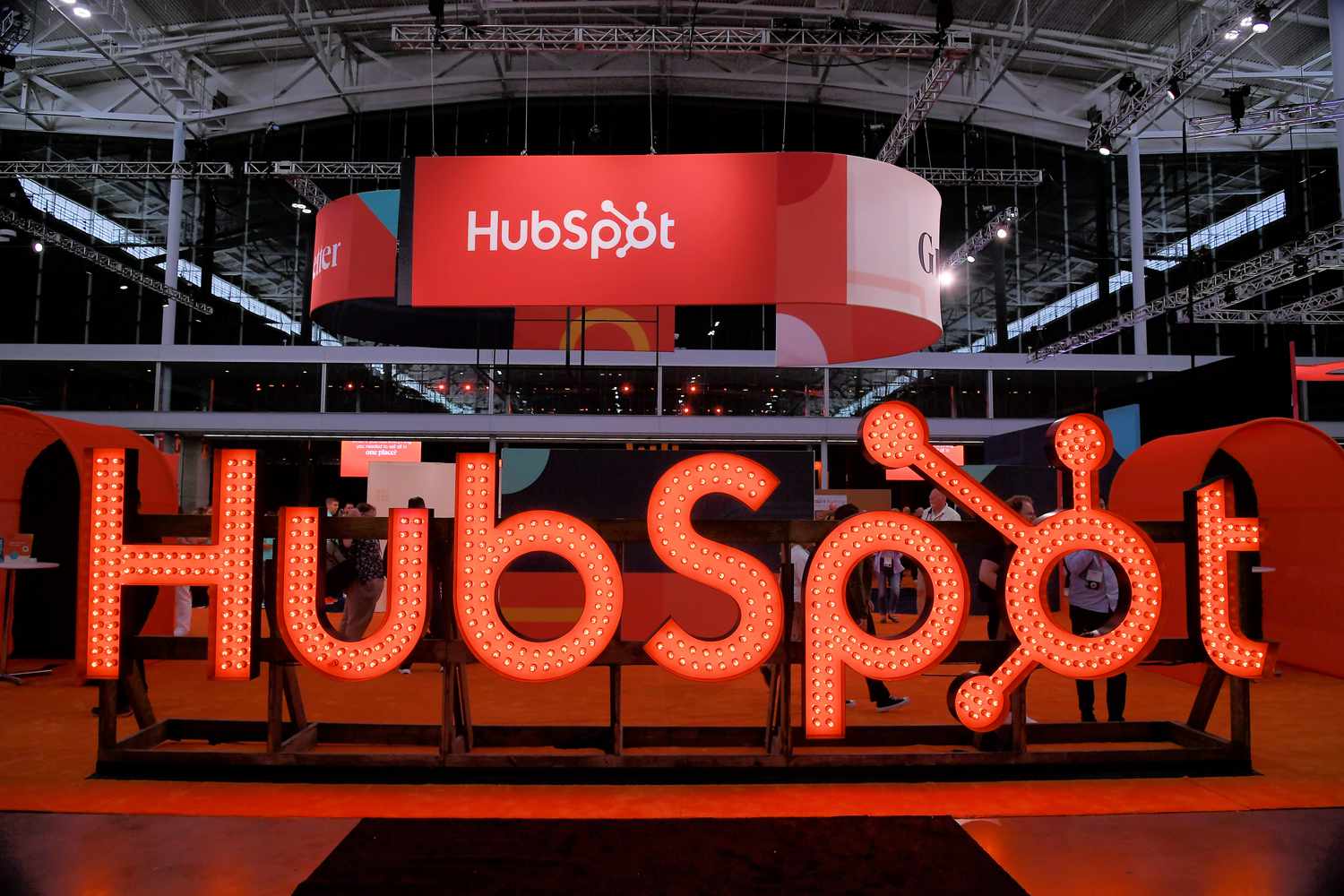 The HubSpot logo on display at a conference.