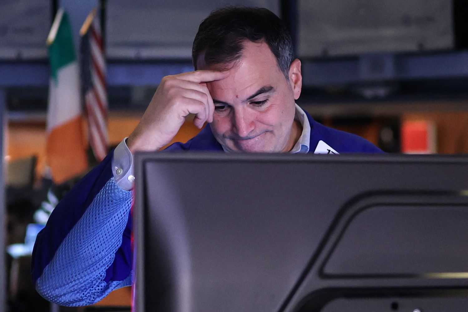 A trader works on the floor of the New York Stock Exchange.