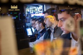 Traders work on the floor of the New York Stock Exchange 