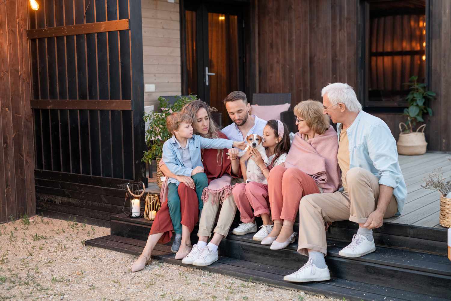 A multigenerational family sitting on steps