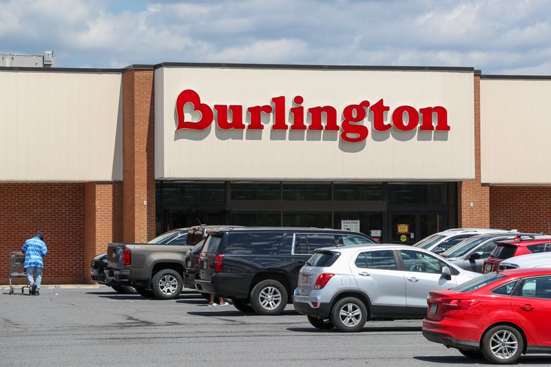 Cars and people are seen outside a Burlington store.