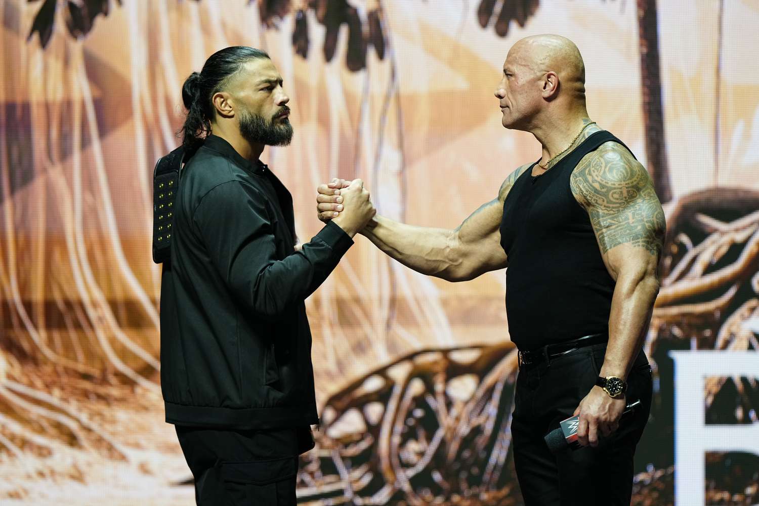 Roman Reigns (L) and Dwayne "The Rock" Johnson (R) during the WWE Wrestlemania XL Kickoff on February 08, 2024, at T-Mobile Arena in Las Vegas, NV