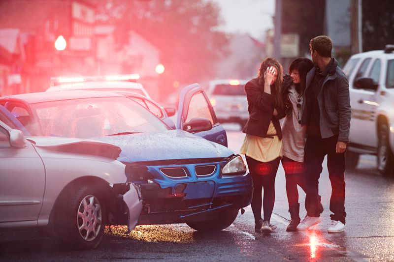 Car accident, woman holding head