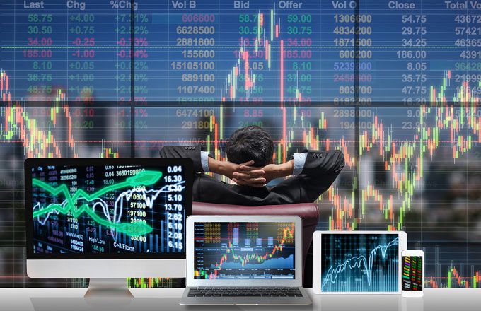 Image of trader and stock chart