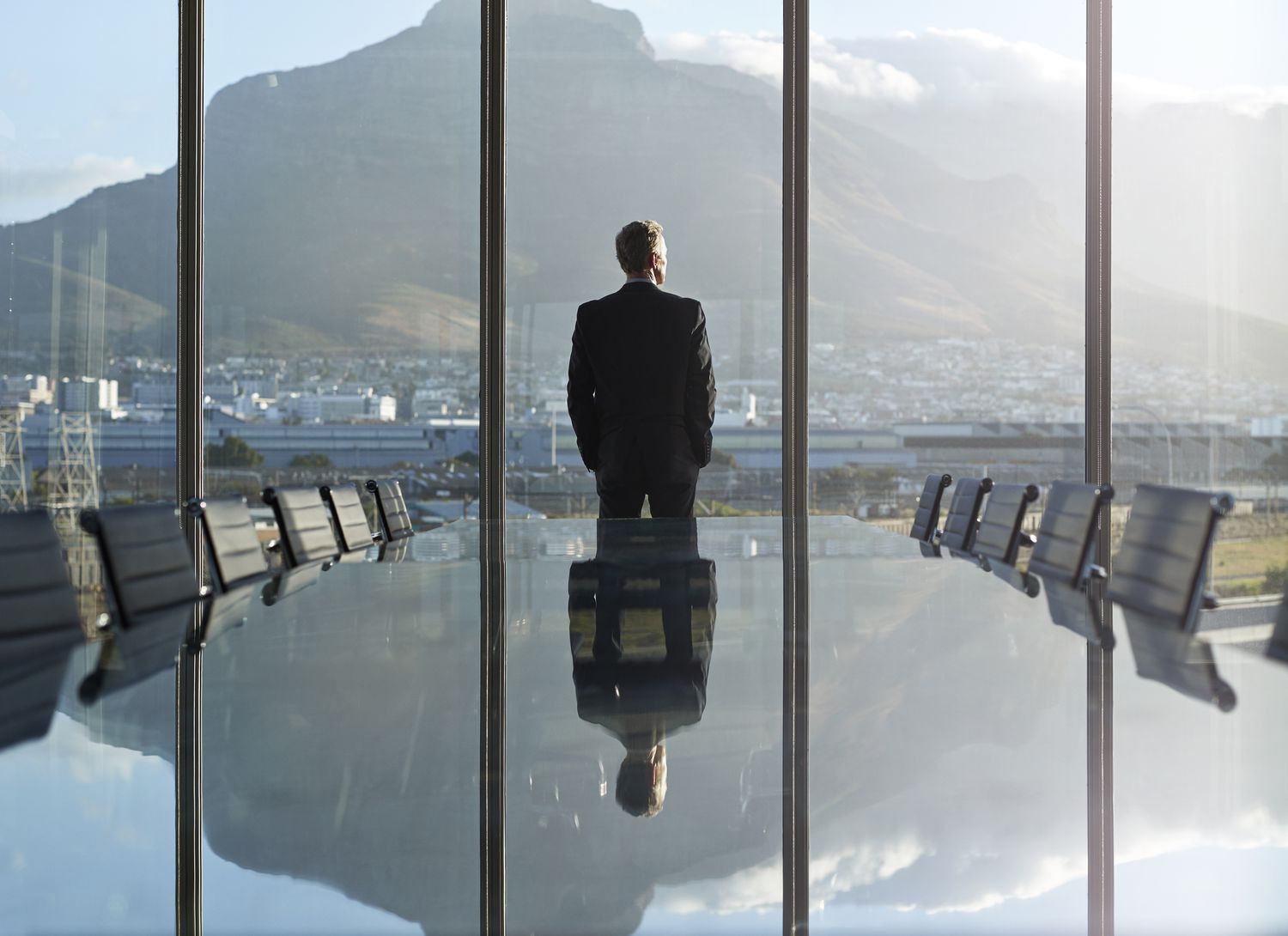 Businessman looking out windows
