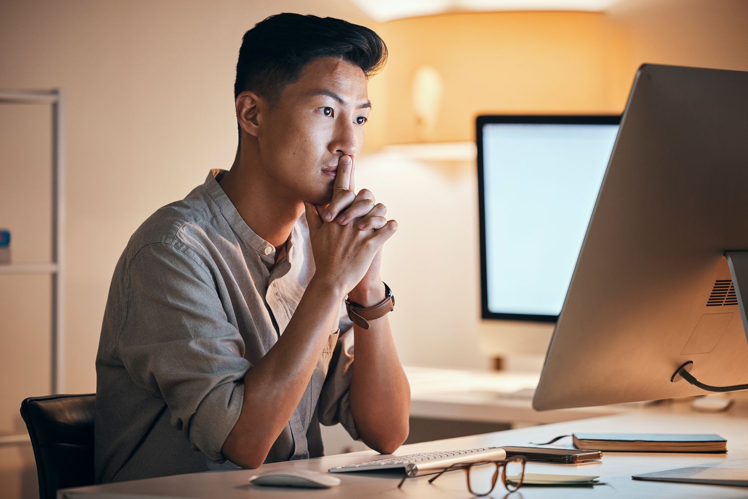 Man looks at computer wondering if Trump's proposed changes to PSLF could affect his forgiveness