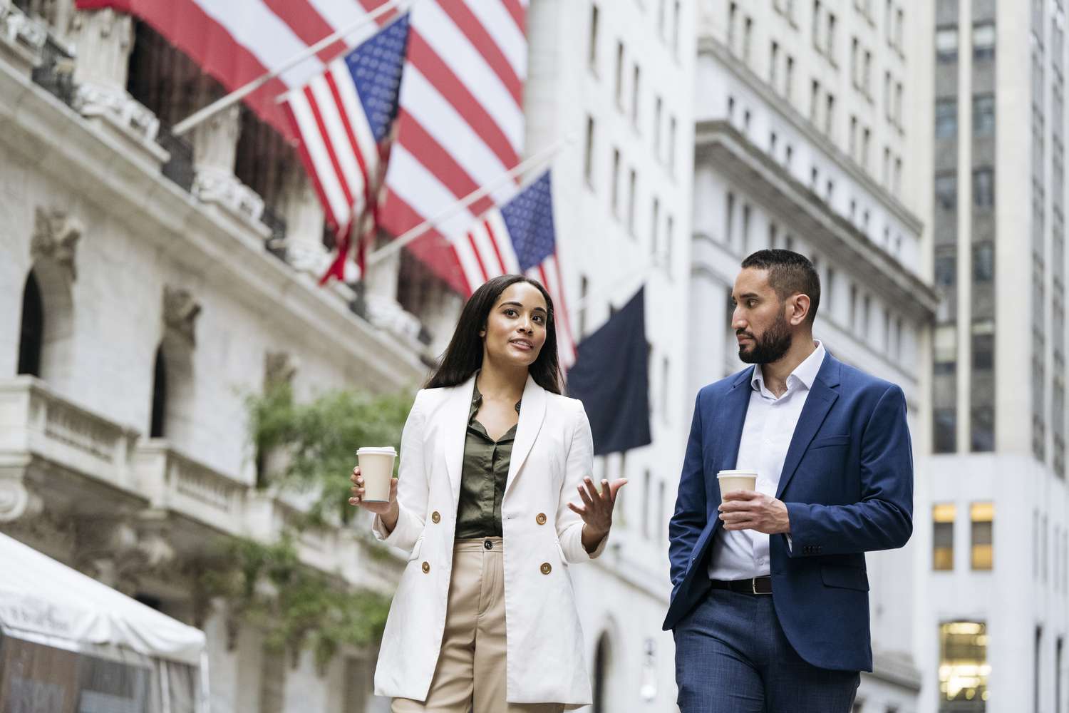 Two colleagues talk outside