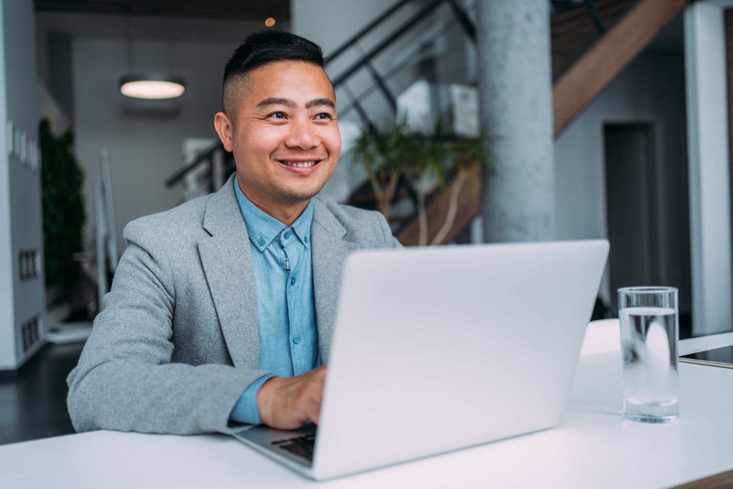 Worker with a laptop in an office