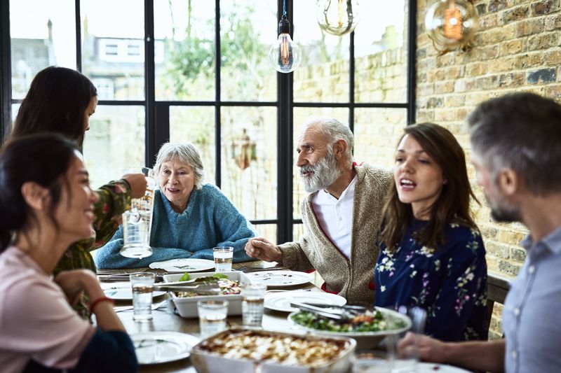 Multi-generational family sitting around a dinner table
