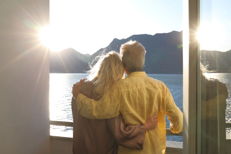 A couple looks at a sunrise