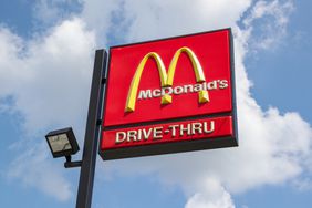 McDonald's logo is seen on a sign outside a fast-food restaurant