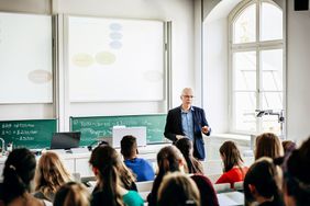 University Lecturer Addressing His Students
