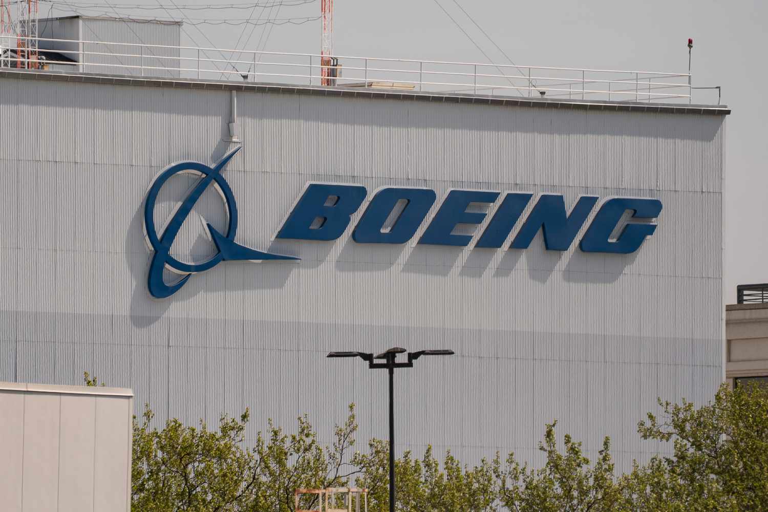 A Boeing facility and the company's logo. 