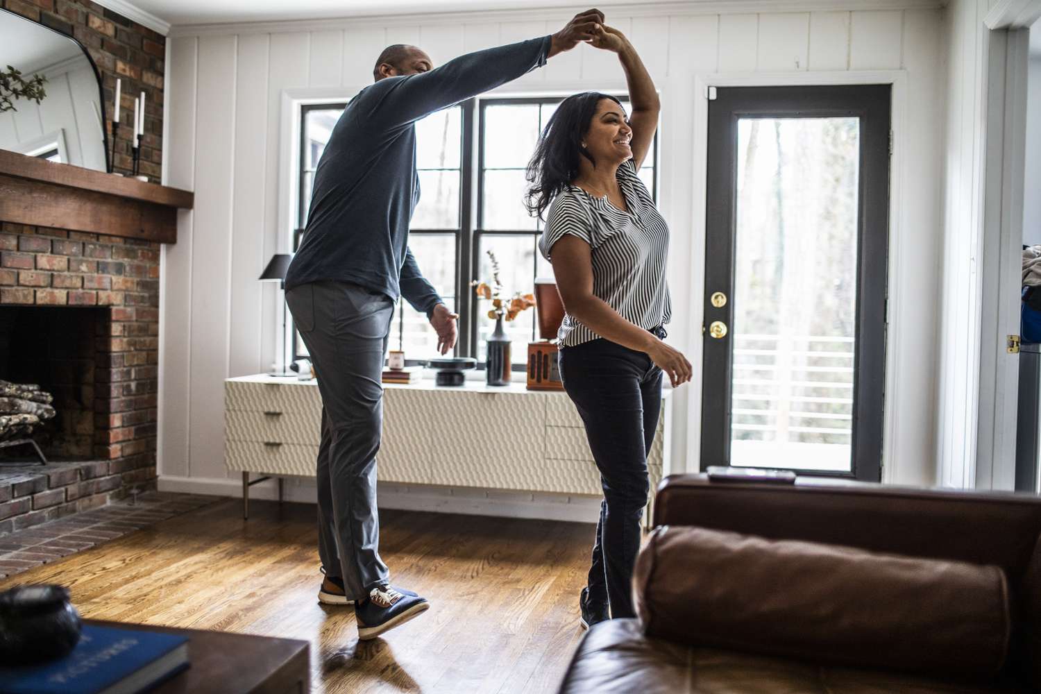Couple dancing in their living room