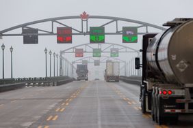 Tractor trailers cross the Peace Bridge at the Canada-US border in Fort Erie, Ontario, Canada, on Monday, Feb. 3, 2025.