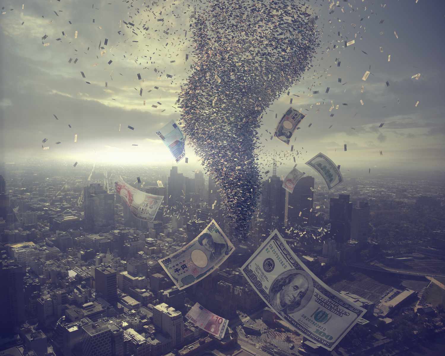 Tornado of money over cityscape.