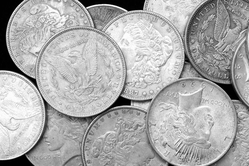 US Silver Dollars on Black Background