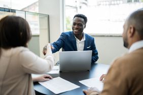 Client shaking hands with financial advisor about CD rates