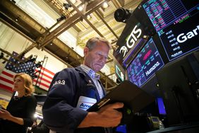 A trader works on the floor of the New York Stock Exchange.