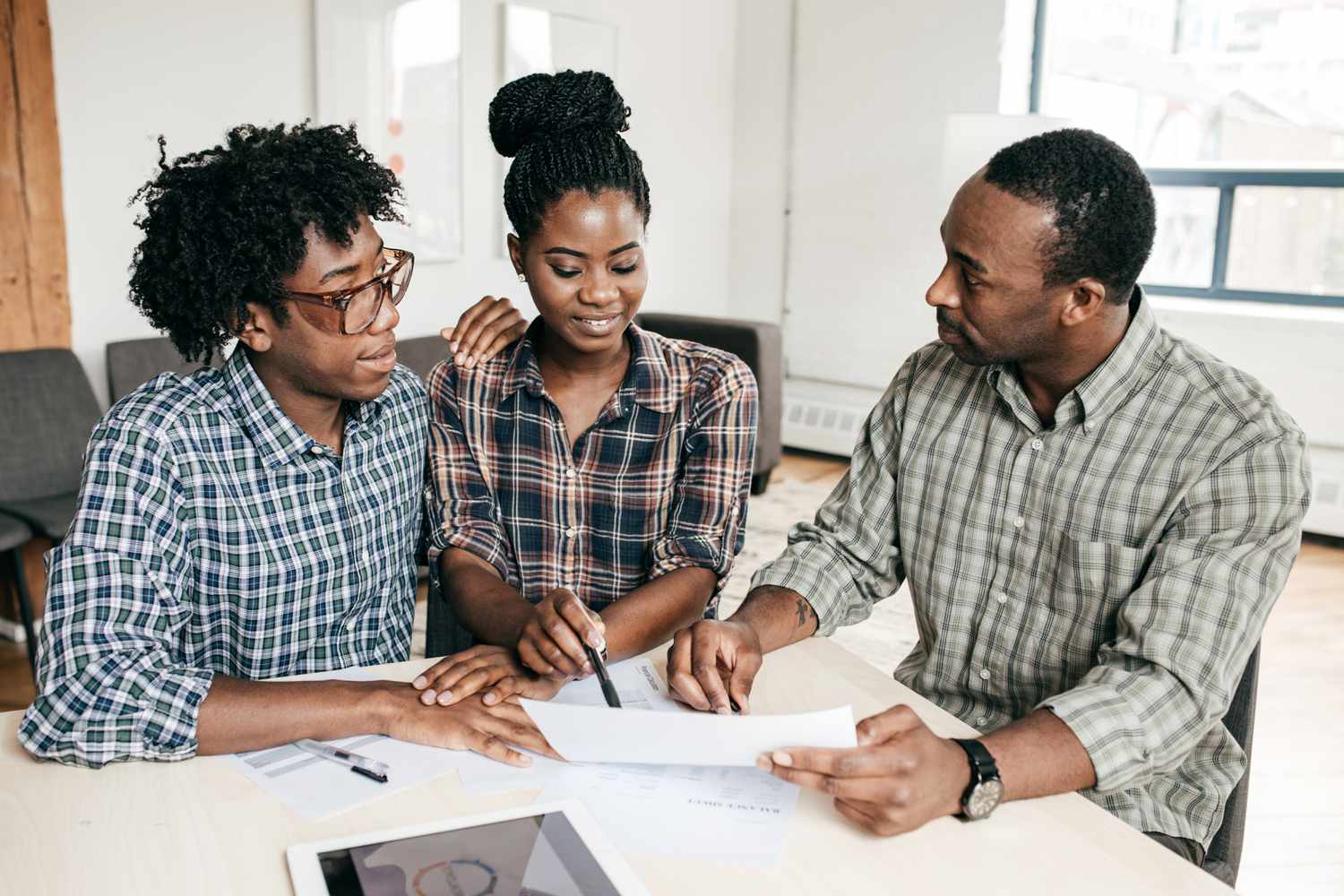 Couple filling out application for a personal loan