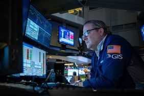A trader works on the floor of the New York Stock Exchange 
