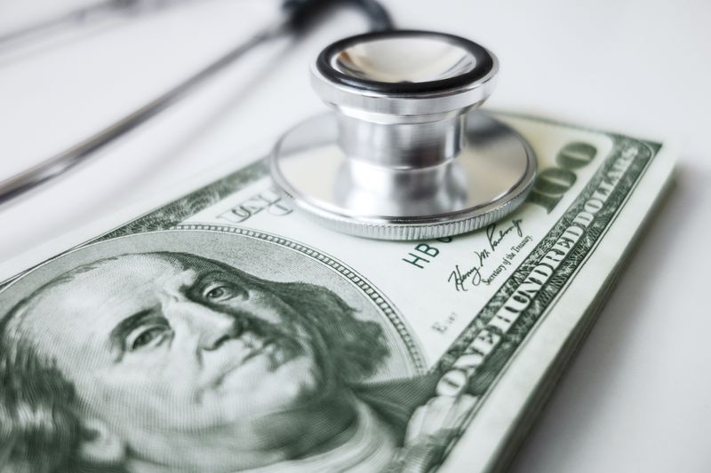 A stethoscope on a hundred dollar bill