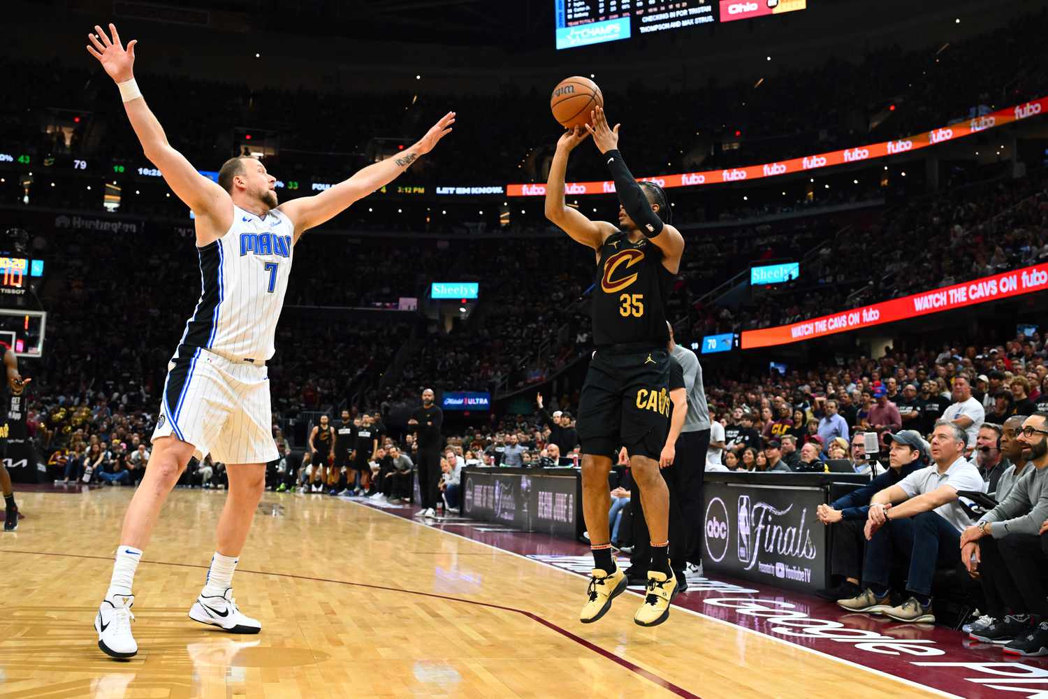 Isaac Okoro #35 of the Cleveland Cavaliers shoots over Joe Ingles #7 of the Orlando Magic during the fourth quarter of Game Seven of the Eastern Conference First Round Playoffs at Rocket Mortgage Fieldhouse on May 05, 2024 in Cleveland, Ohio