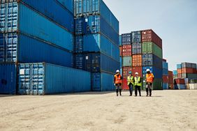Workers with shipping containers