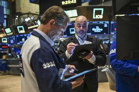 Traders work on the floor of the New York Stock Exchange