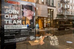 A hiring sign outside a Chipotle restaurant in August. 