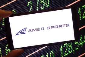 The Amer Sports company logo is seen displayed on a smartphone screen