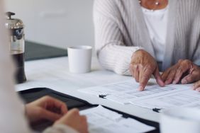 Elderly couple going over financial documents