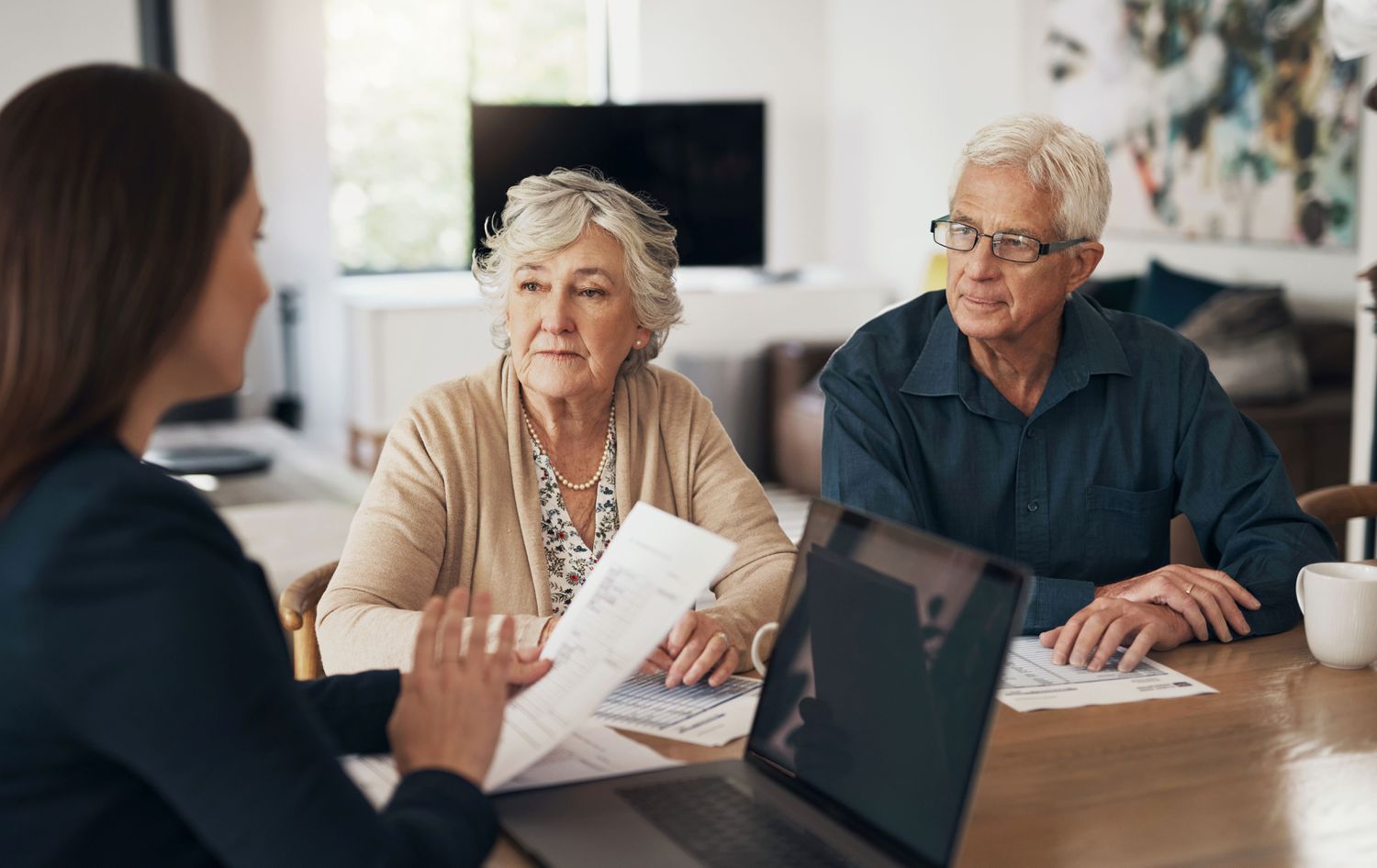 Three people in a meeting in an office