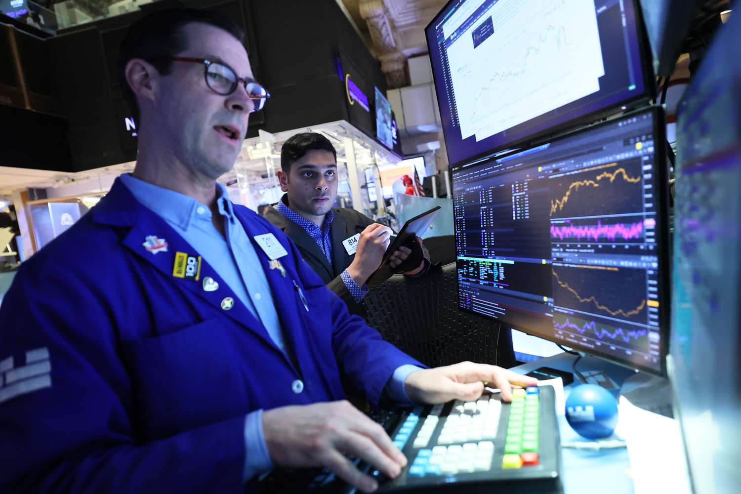 Traders work on the floor of the New York Stock Exchange