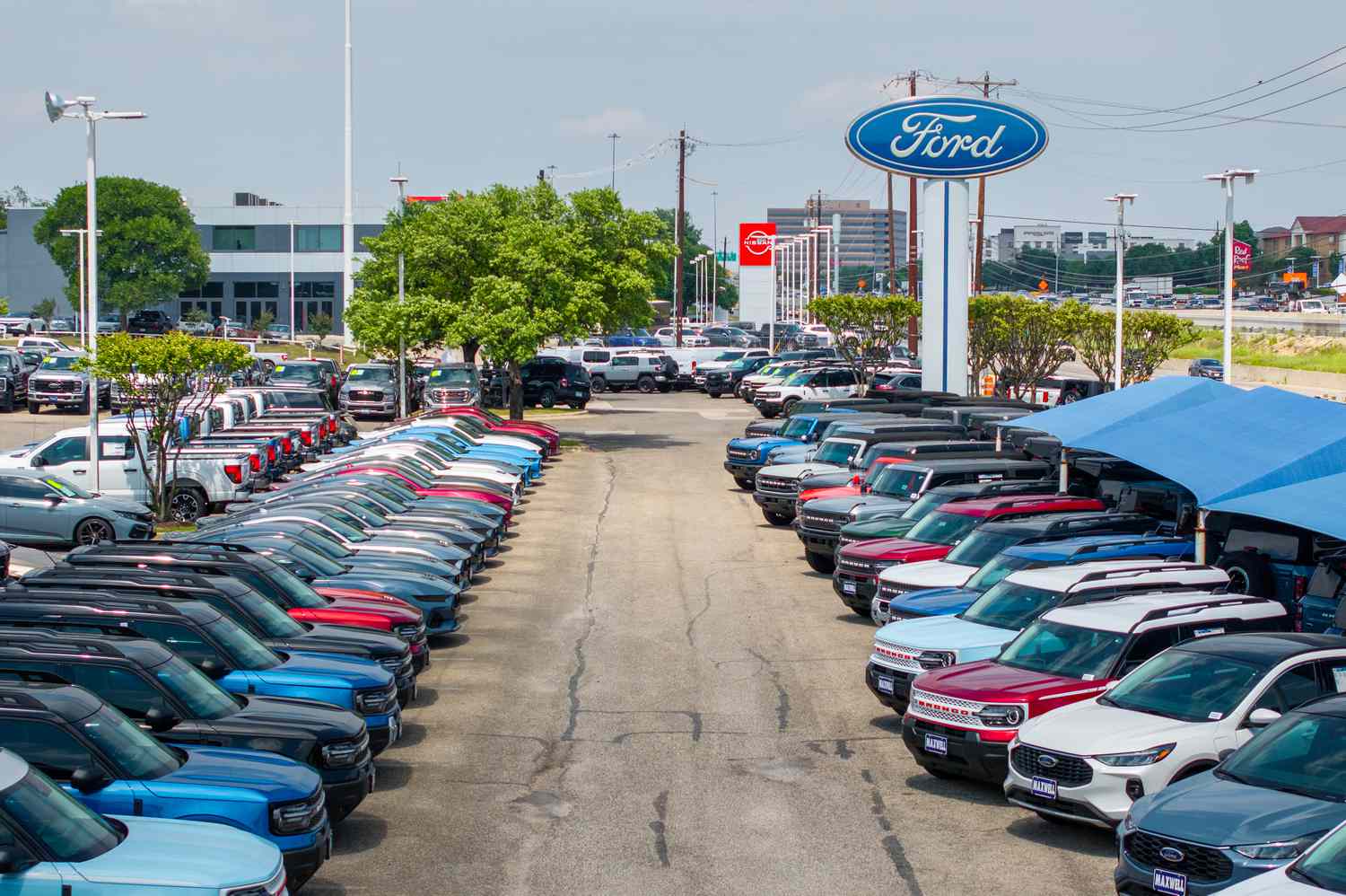 In an aerial view, Ford vehicles are seen on a lot at a dealership on April 18, 2025 in Austin, Texas.