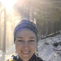A photo of Heather van der Hoop in a snowy forest.