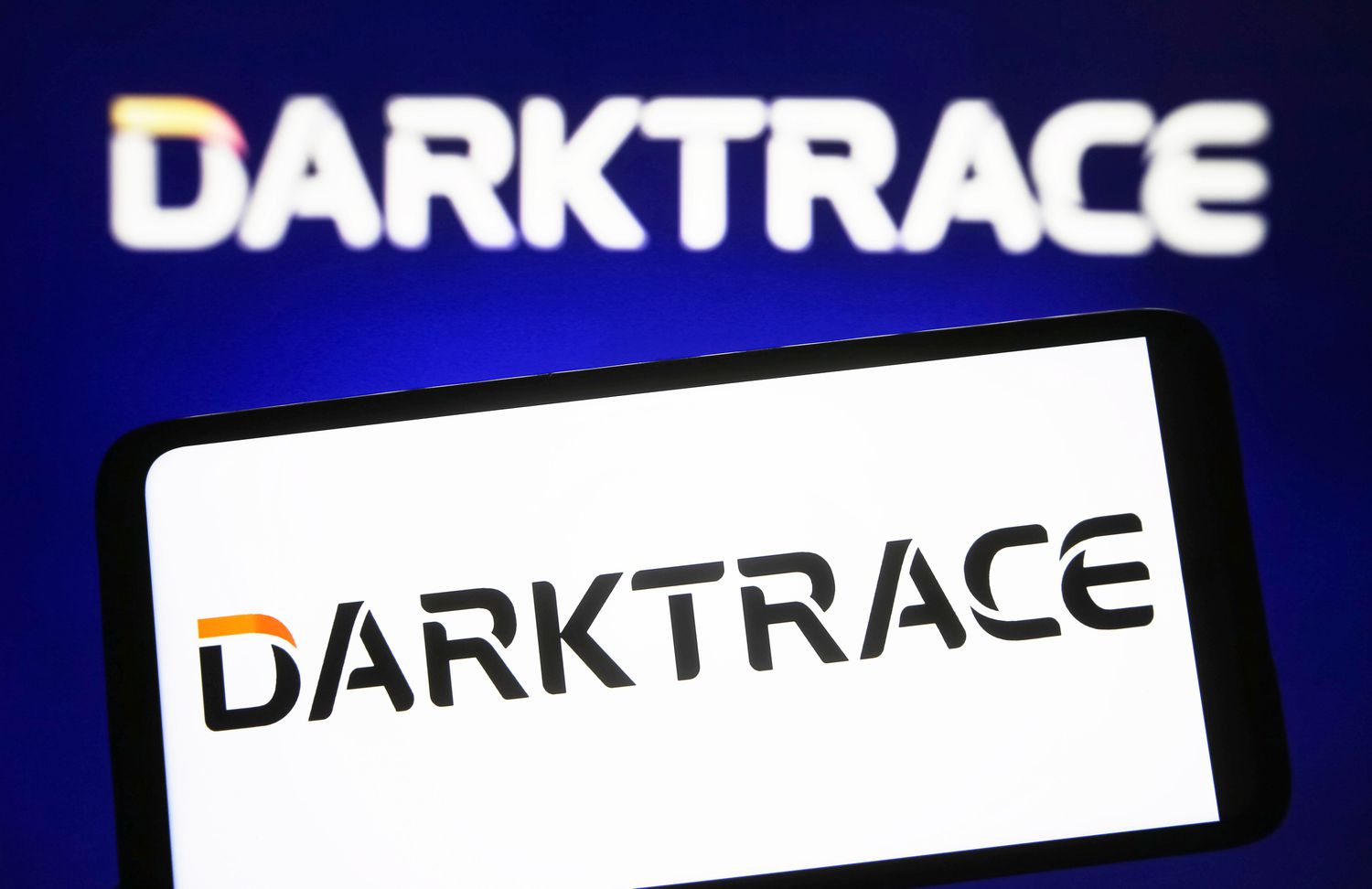 Darktrace logo on a smartphone. 