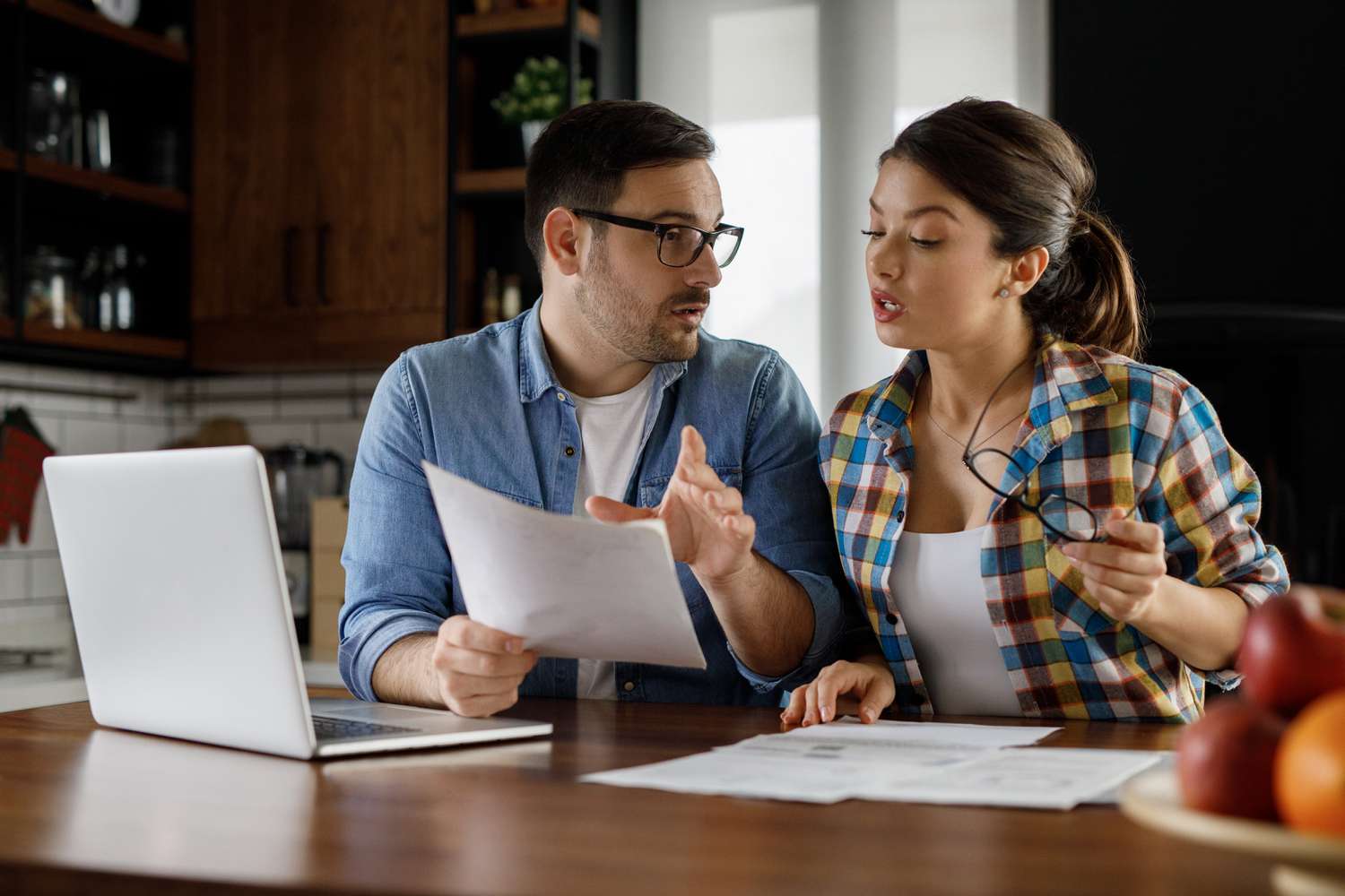 A couple in a heated discussion about getting their first home.