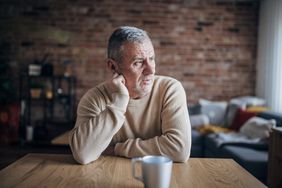 An upset man at a table