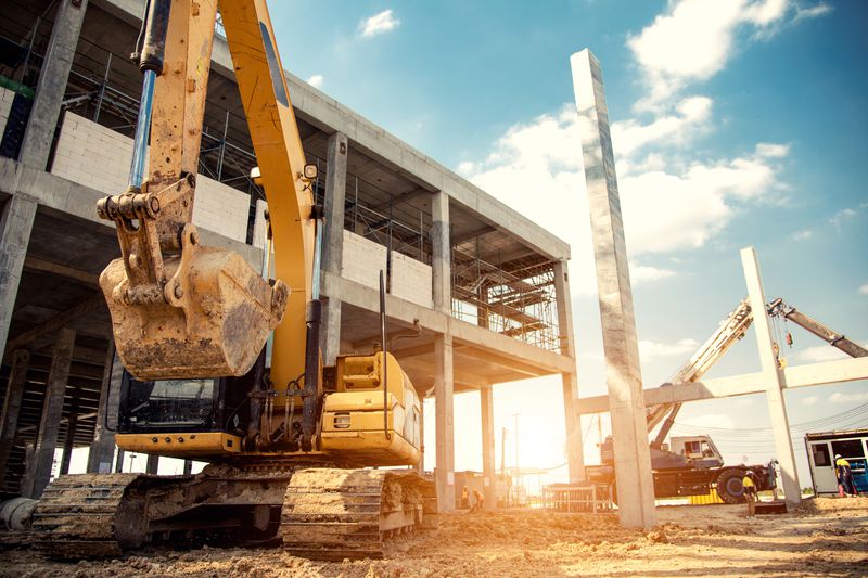 construction equipment in construction new warehouse background