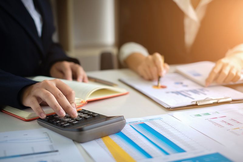 Business Woman or Accountant Working With Calculator for Investigation of Corruption Account